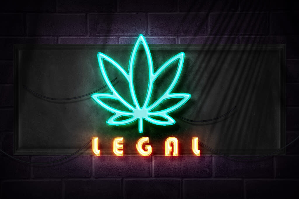 marijuana symbol with legal text in neon lights