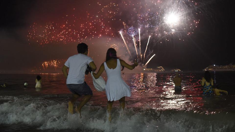 new year's eve good luck traditions wear white and jump over seven waves