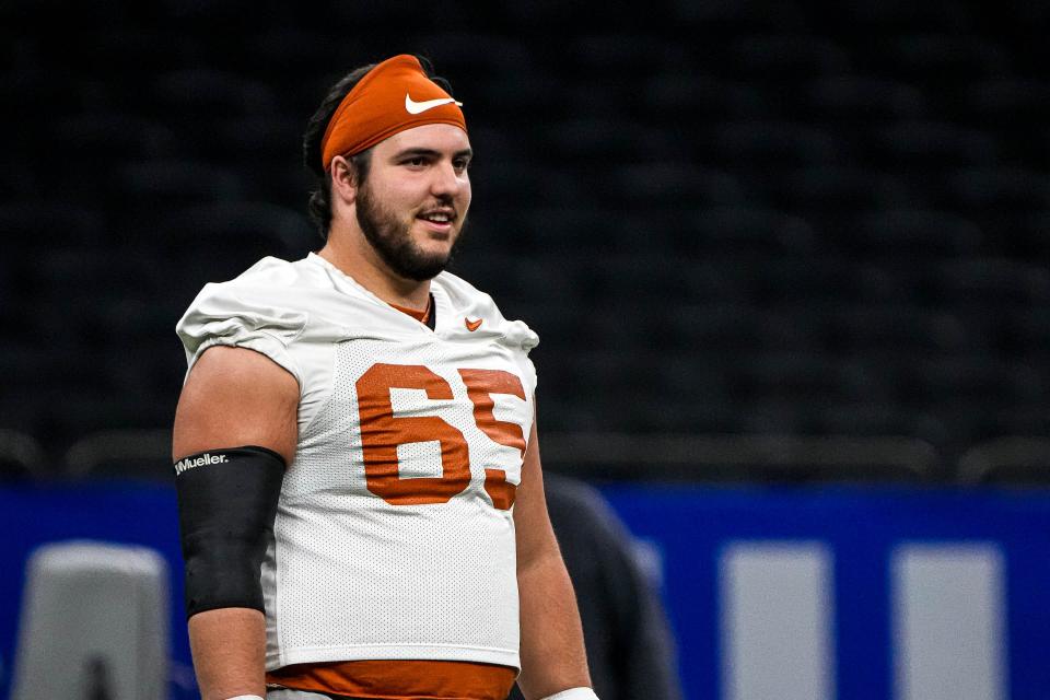 Texas Longhorns offensive lineman Jake Majors practices at the Superdome on Saturday in New Orleans. The Longhorns will take on the Washington Huskies in the College Football Playoff semifinals on Monday.