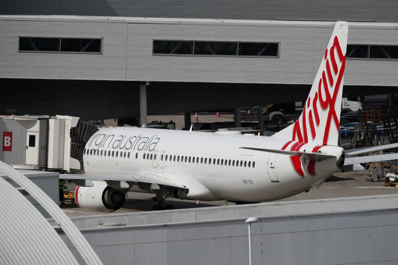 FILE PHOTO: A Virgin Australia plane at Kingsford Smith International Airport after Australia implemented an entry ban on non-citizens and non-residents due to the coronavirus outbreak