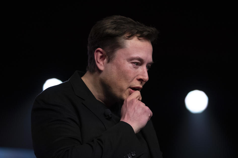 Tesla CEO Elon Musk pauses while speaking before unveiling the Model Y at the company's design studio Thursday, March 14, 2019, in Hawthorne, Calif. The Model Y may be Tesla's most important product yet as it attempts to expand into the mainstream and generate enough cash to repay massive debts that threaten to topple the Palo Alto, California, company. (AP Photo/Jae C. Hong)