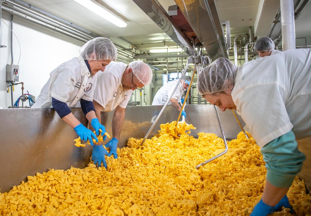 Store manager Rhonda Eppers and cheese maker Fred Sebold work with the rest of their small team to make their cheese curds at Nasonville Dairy in Curtiss, Wisconsin on Friday, March 22, 2024. Gabi Broekema/USA TODAY NETWORK- Wisconsin