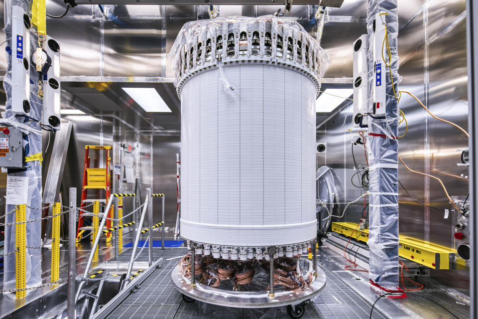 This photo provided by Sanford Underground Research Facility shows the LZ central detector in the clean room at Sanford Underground Research Facility after assembly, before beginning its journey underground in Lead, S.D. Scientists have begun a new search for mysterious dark matter in a former gold mine a mile underground. Dark matter makes up the vast majority of the mass of the universe but scientists don't know what it is. (Matthew Kapust/Sanford Underground Research Facility via AP)