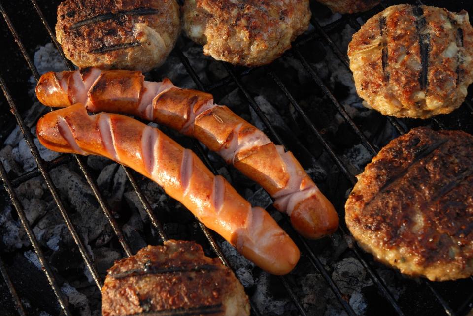 (GERMANY OUT) barbecue with sausages and hamburger (Photo by JOKER/Erich Haefele/ullstein bild via Getty Images)