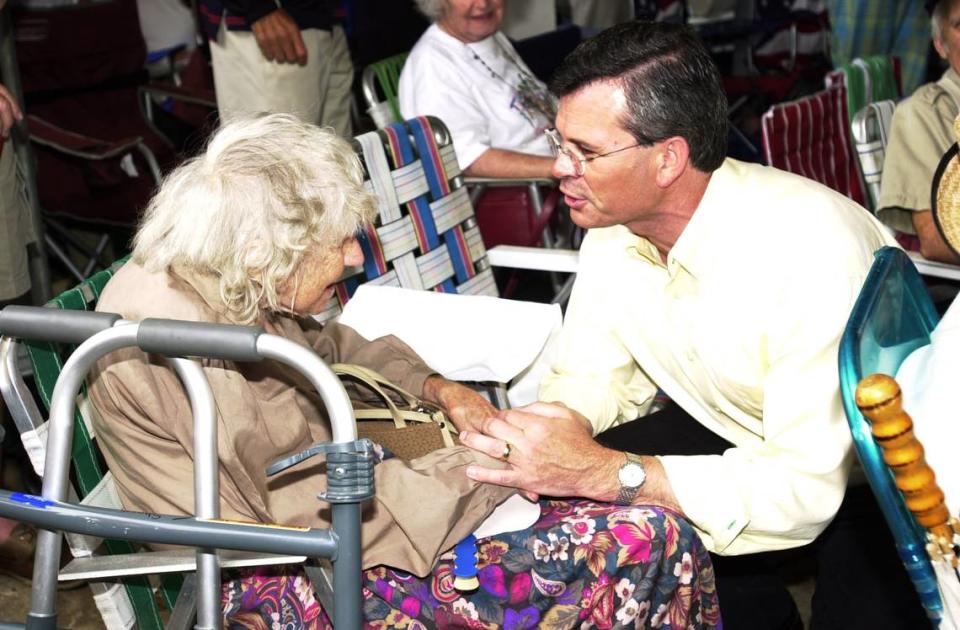 Congressman and candidate for Gov. of Kentucky, Ernie Fletcher talks with Iva Sharp, 84 years old from Princeton, Ky. at the Fancy Farm picnic.,on Sat. afternoon. Today, August 2, 2003, marks the 123th meeting of politicians that gather at Fancy Farm, Kentucky to campaign for the up coming November elections. The event draws Kentuckians from all over the State, especially in election years.