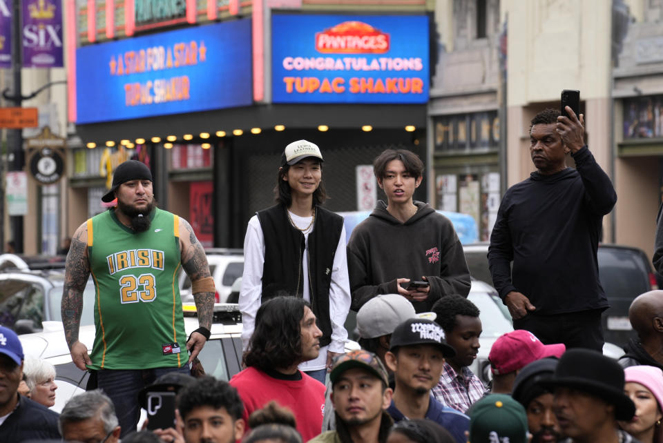 Fans look on during a ceremony honoring the late rapper and actor Tupac Shakur with a star on the Hollywood Walk of Fame on Wednesday, June 7, 2023, in Los Angeles. (AP Photo/Chris Pizzello)