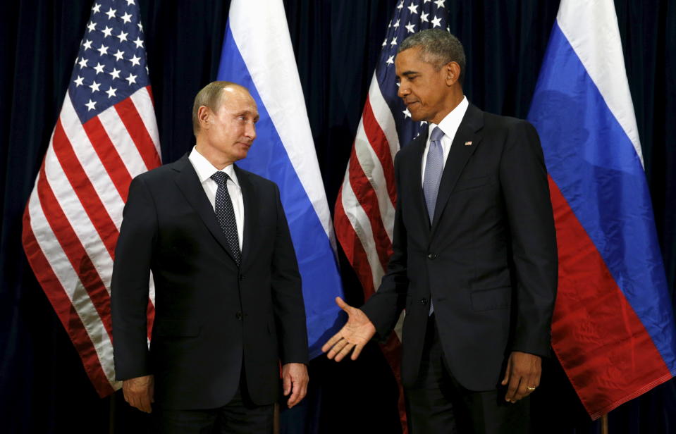 U.S. President Barack Obama extends his hand to Russian President Vladimir Putin during their meeting at the United Nations General Assembly in New York September 28, 2015.