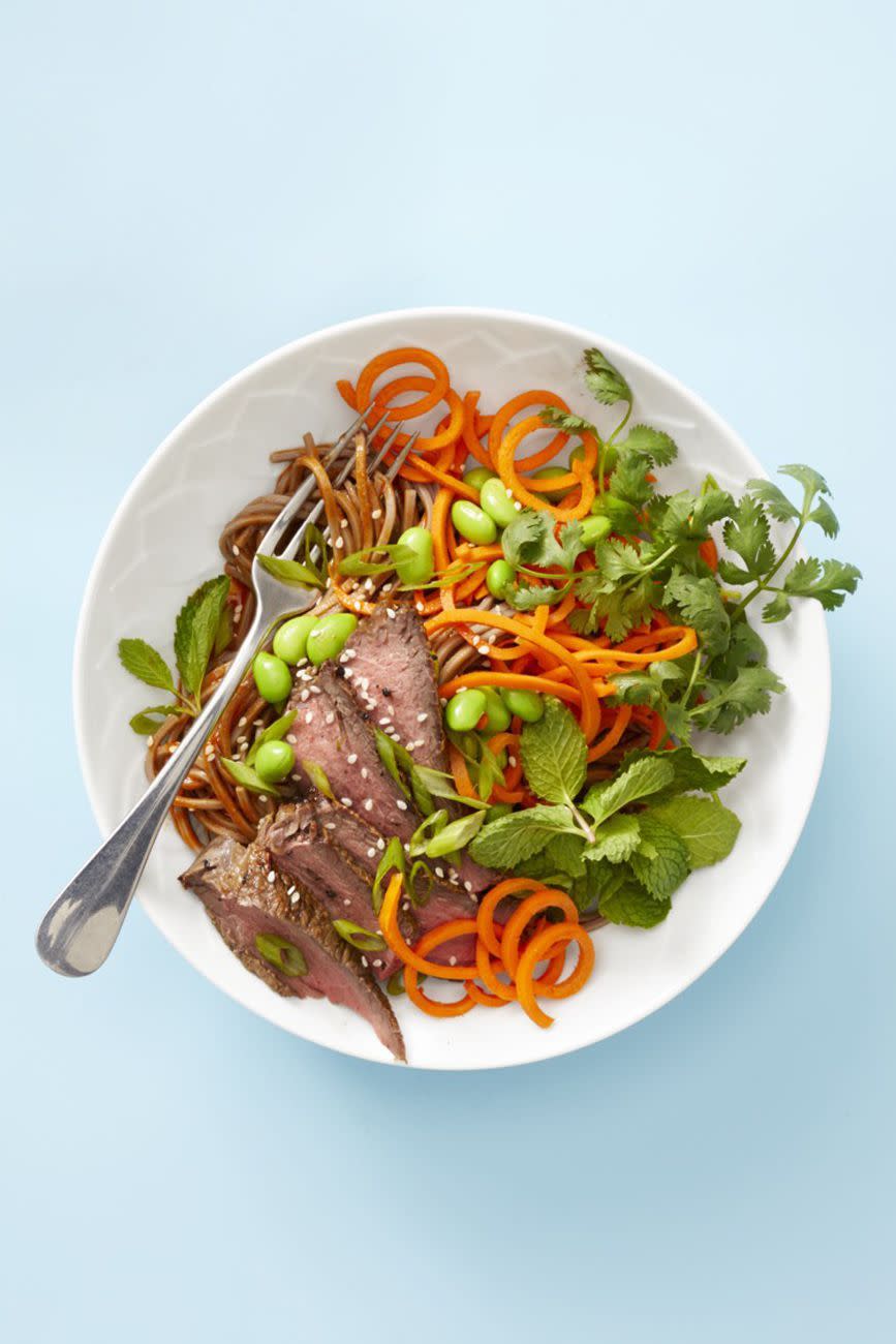 asian marinated steak with noodles and carrot spirals