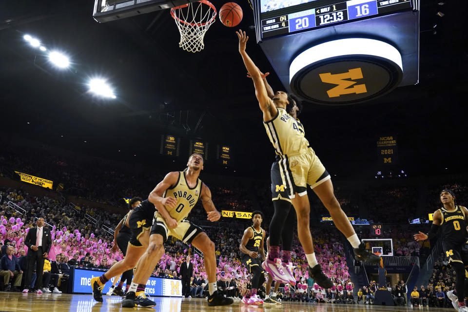 Purdue forward Trey Kaufman-Renn (4) drives on Michigan forward Tarris Reed Jr. (32) in the first half of an NCAA college basketball game in Ann Arbor, Mich., Thursday, Jan. 26, 2023. (AP Photo/Paul Sancya)