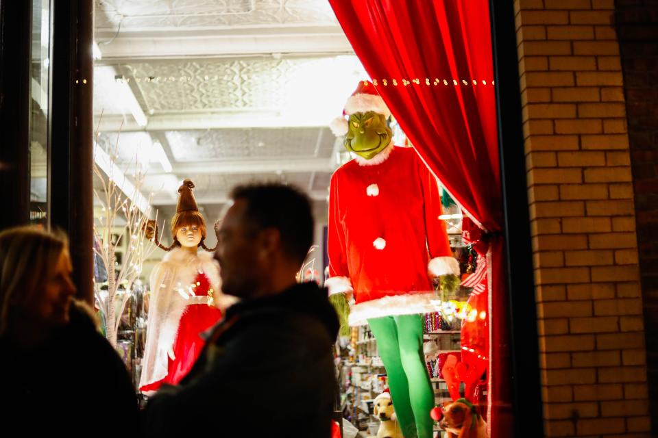 Cindy Lou Who and Grinch hang out in a window display during the Jingle in the Junction at the Historic Valley Junction on Thursday, Dec. 1, 2022.