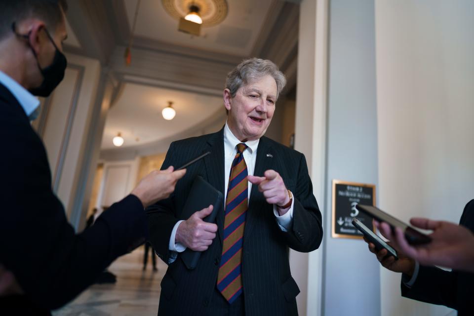 Sen. John Kennedy, R-La., pauses for reporters as senators rush to the chamber for votes ahead of the approaching Memorial Day recess, at the Capitol in Washington, Wednesday, May 26, 2021.