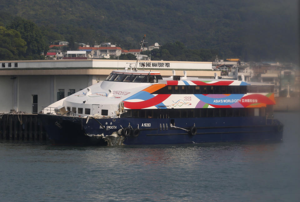 A damaged ferry is docked at a pier after a collision in Lamma Island, off the southwestern coast of Hong Kong Tuesday, Oct. 2, 2012. The ferry on Monday collided with a boat owned by utility company Power Assets Holdings Ltd., which was taking its workers and their families to famed Victoria Harbor to watch a fireworks display in celebration of China's National Day and mid-autumn festival, killing at least 36 people. (AP Photo/Kin Cheung)