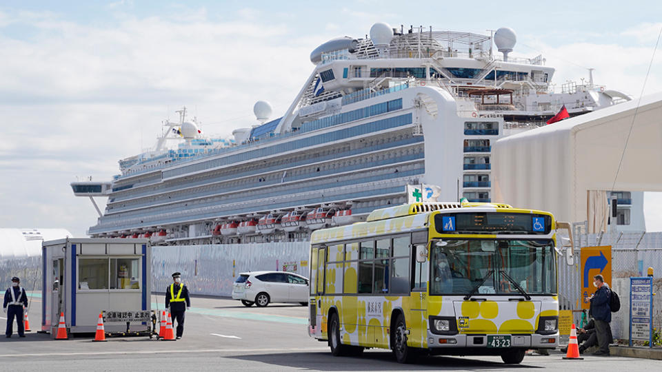 A bus carrying passengers of the Diamond Princess cruise ship leaves the Daikoku Pier Cruise Terminal in Yokohama, south of Tokyo. Source: EPA