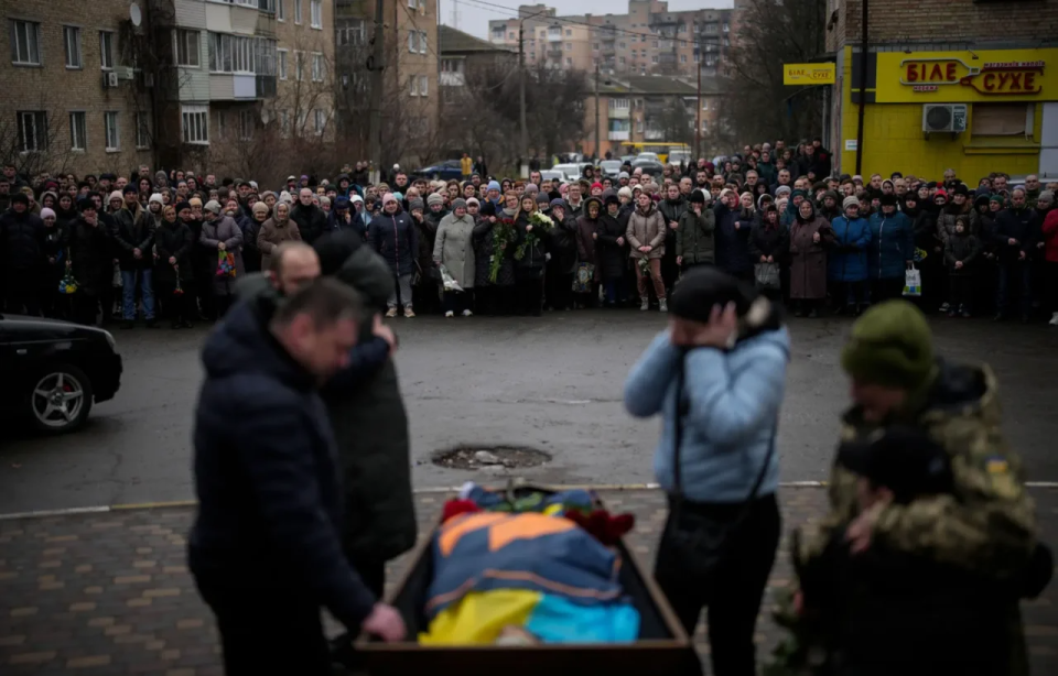 Residents of Bucha gathered to honor Ukrainian soldier Oleksiy Zavadsky, who was killed in action in Bakhmut, Bucha, Ukraine, January 19 <span class="copyright">Daniel Cole—AP</span>