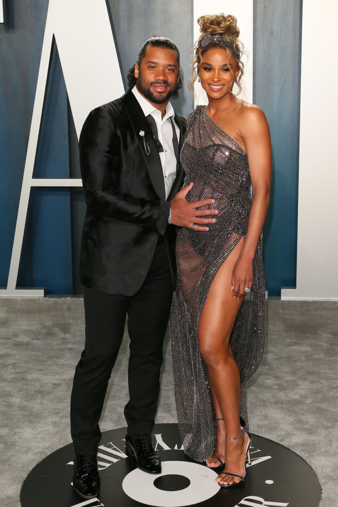 The pregnant star arrived on the Vanity Fair grey carpet with husband Russell Wilson (Getty)