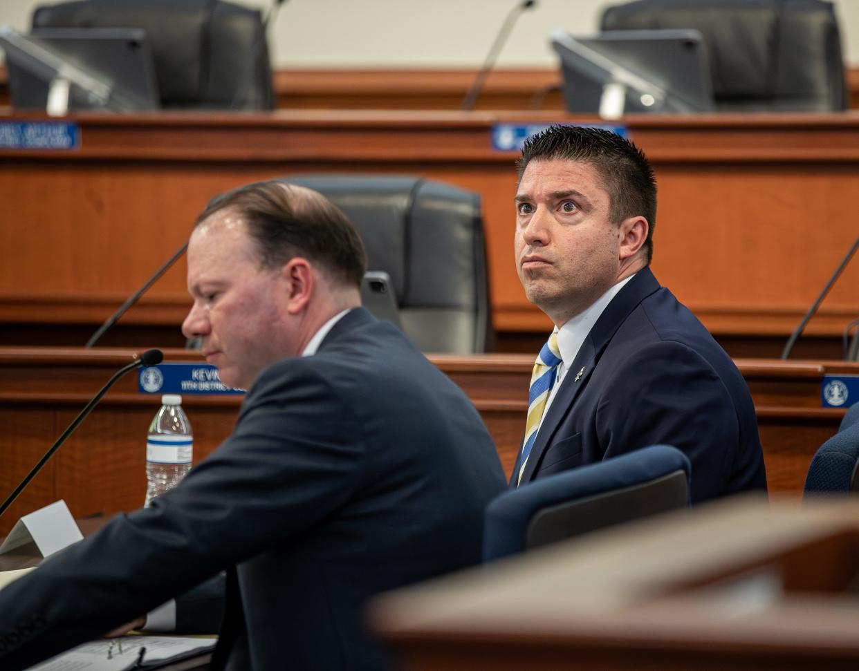 Metro councilmember Anthony Piagentini, right, and his attorney J. Brooken Smith, listened during opening arguements as the public hearing for Anthony Piagentini began on Monday night in the Louisville Metro Council chambers. The Council will weigh the removal of Piagentini following a commission's findings last year that he violated the ethics code. Monday Feb. 26, 2024