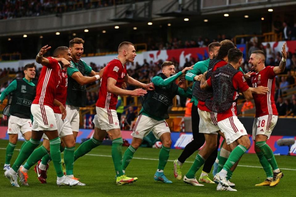 Hungary's defender Zsolt Nagy, right, celebrates with teammates after scoring their third goal (AFP)