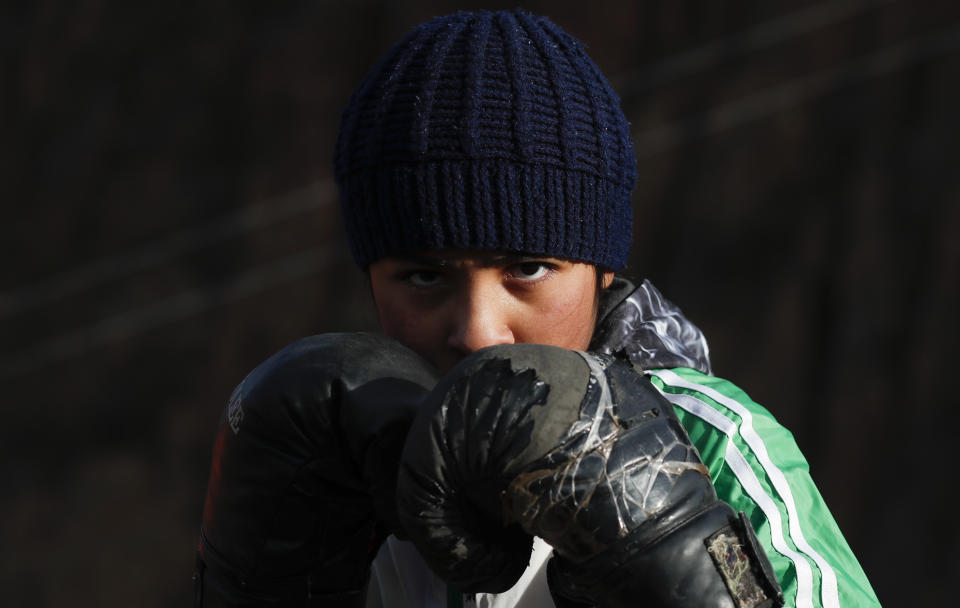 Gracce Kelly Flores, a 12-year-old boxer who goes by the nickname Hands of Stone, poses for a photo during her daily boxing workout as she trains under the coaching of her father in Palca, Bolivia, early Thursday, June 10, 2021, amid the COVID-19 pandemic. At age 8, Flores defeated a 10-year-old boy, and with three national boxing medals under her belt, she dreams of reaching the women's boxing world championship. (AP Photo/Juan Karita)