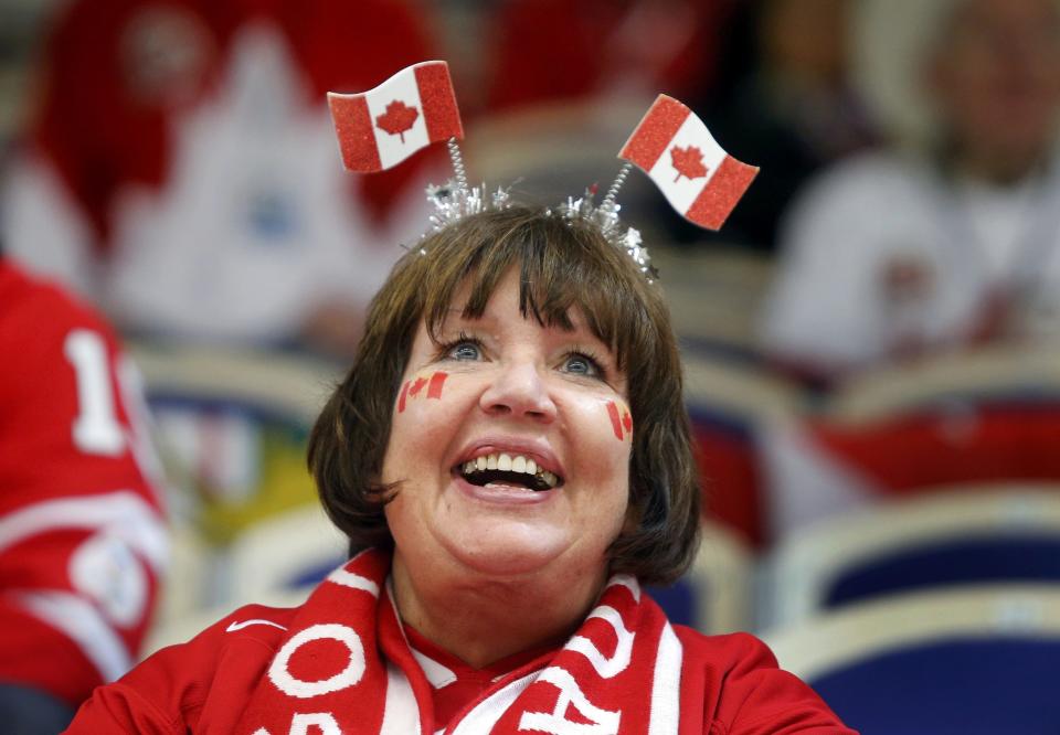 A Canada supporter smiles during a break in play against Germany of their IIHF World Junior Championship ice hockey game in Malmo, Sweden, December 26, 2013. REUTERS/Alexander Demianchuk (SWEDEN - Tags: SPORT ICE HOCKEY)