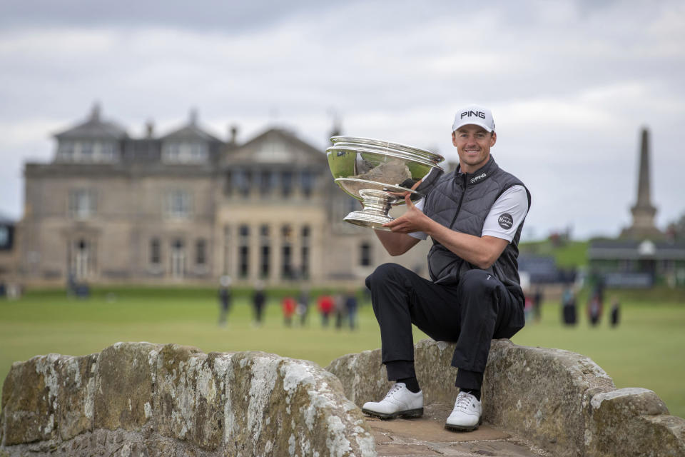 Victor Perez poses with the trophy following his win of the Links Championship at St Andrews in Scotland, Sunday Sept. 29, 2019. (Kenny Smith/PA via AP)