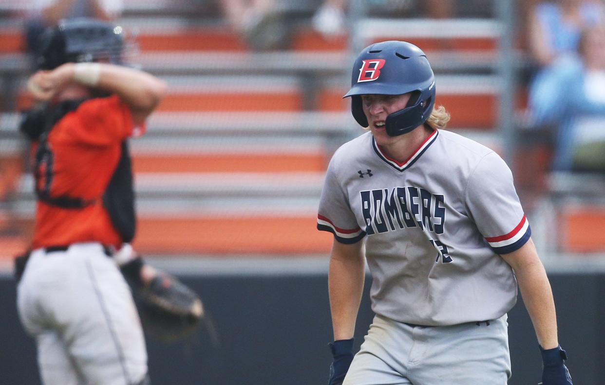 Ballard's Eli Rouse (12) celebrates after a score against Ames during the third inning of the Bombers' 14-2 victory over the Little Cyclones in six innings at the Ames Baseball Field on Tuesday, June 18, 2024, in Ames, Iowa.