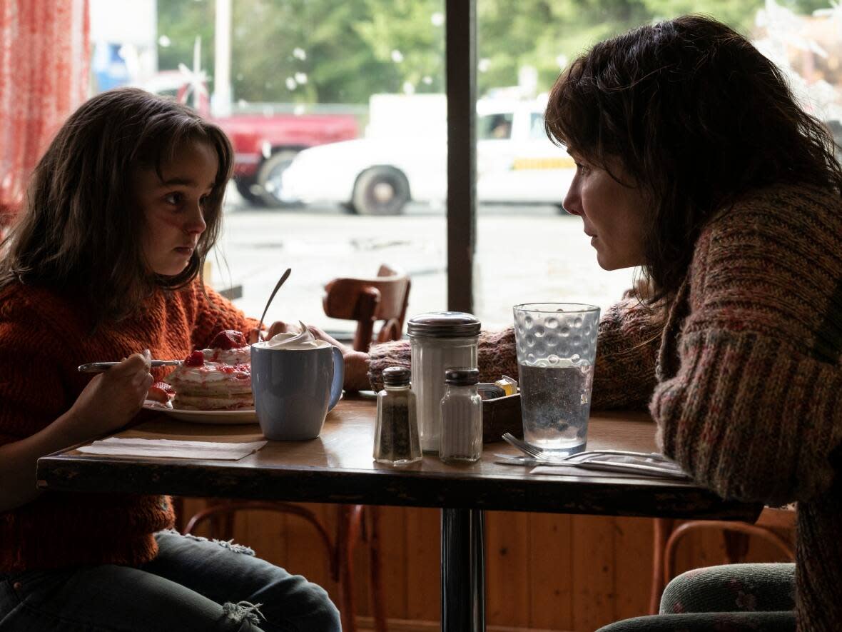 Neli Kastrinos, 8, plays a young Katie alongside Sandra Bullock in The Unforgivable.   (Kimberley French/Netflix - image credit)