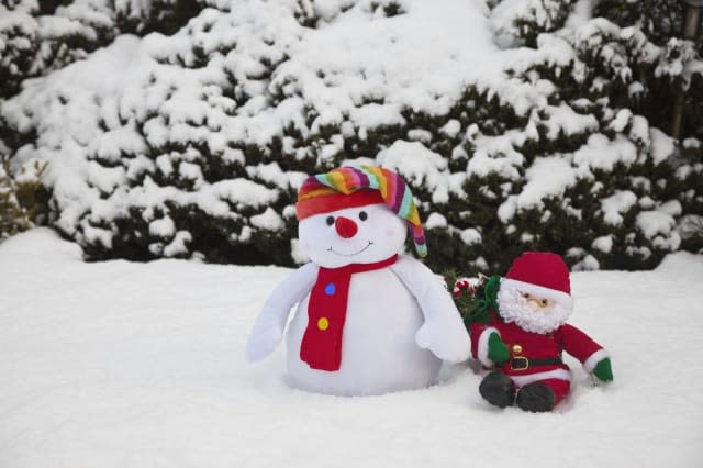 snowman with santa claus doll