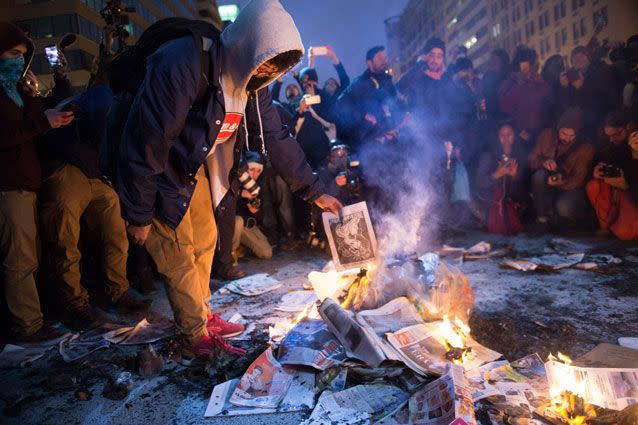 Bonfires burn in the capital's streets. Source: AP