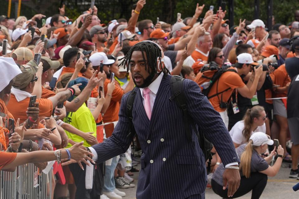 Jaylan Ford, making his way past the crowd before the game against Wyoming in September, has been "invaluable " for the UT football program, UT coach Steve Sarkisian said.