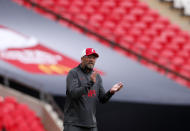 Liverpool manager Jurgen Klopp gives instructions to his players during the English FA Community Shield soccer match between Arsenal and Liverpool at Wembley stadium in London, Saturday, Aug. 29, 2020. (Andrew Couldridge/Pool via AP)