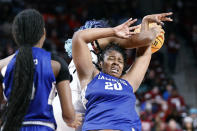 Hampton forward Nylah Young (20) battles South Carolina forward Aliyah Boston for a rebound during the first quarter of an NCAA college basketball game in Columbia, S.C., Sunday, Nov. 27, 2022. (AP Photo/Nell Redmond)