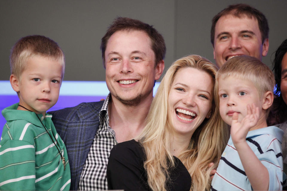 Elon Musk, CEO of Tesla Motors, stands with his fiancee Talulah Riley and his twin sons Griffin, left, 6, and Xavier at the Nasdaq's opening bell to celebrate the electric automaker's initial public offering, Tuesday, June, 29, 2010, in New York. (AP Photo/Mark Lennihan)