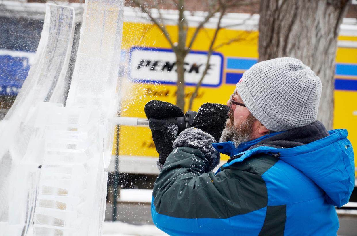 Matthew Cooper of Icon Ice works on an ice sculpture on Saturday, Feb. 18, 2023 during the Winter Wonderland Weekend in downtown Petoskey.