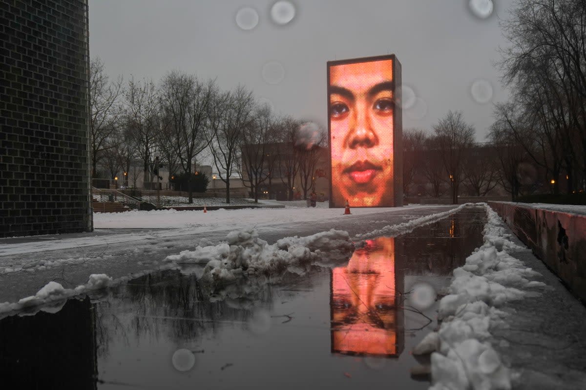 Snow falls on the Crown Fountain in Millennium Park during a winter storm, Friday, Jan. 12, 2024, in Chicago (Copyright 2024 The Associated Press. All rights reserved.)