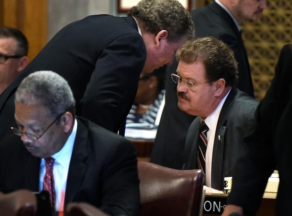 House Majority Leader Gerald McCormick, R-Chattanooga talks with Jerry Sexton, R-Bean Station before a vote on his bill Sexton sponsored the bible bill that was vetoed by the governor.Wednesday April 20, 2016, in Nashville, TN