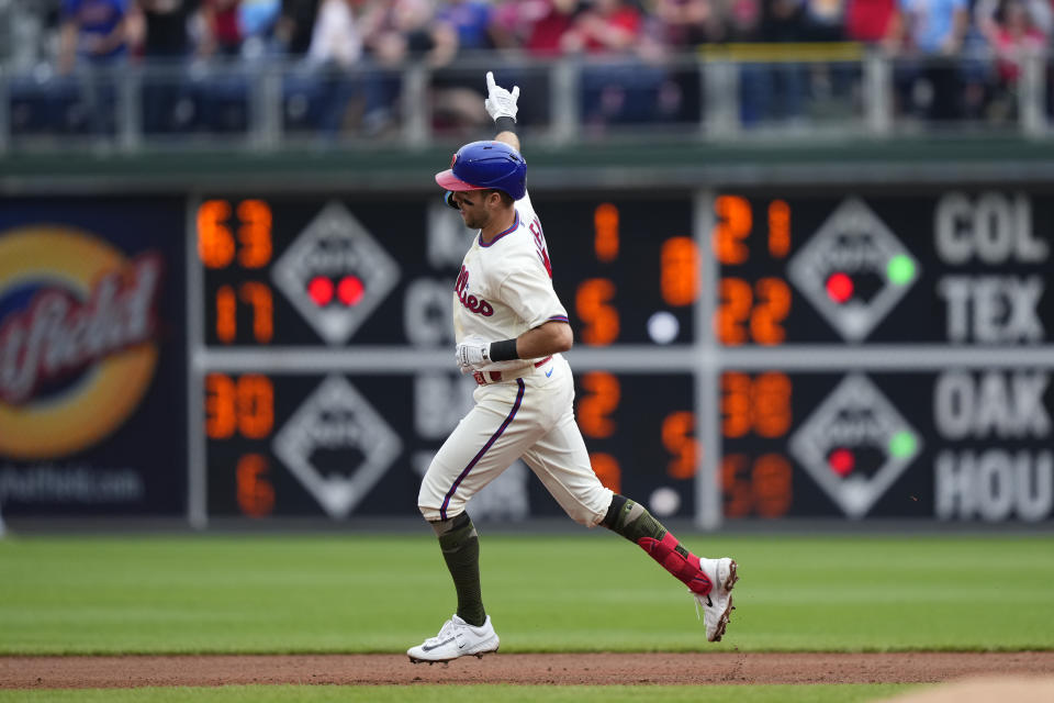 Philadelphia Phillies' Kody Clemens rounds the bases after hitting a two-run home run off of Chicago Cubs' Jameson Taillon during the first inning of a baseball game, Saturday, May 20, 2023, in Philadelphia. (AP Photo/Matt Rourke)