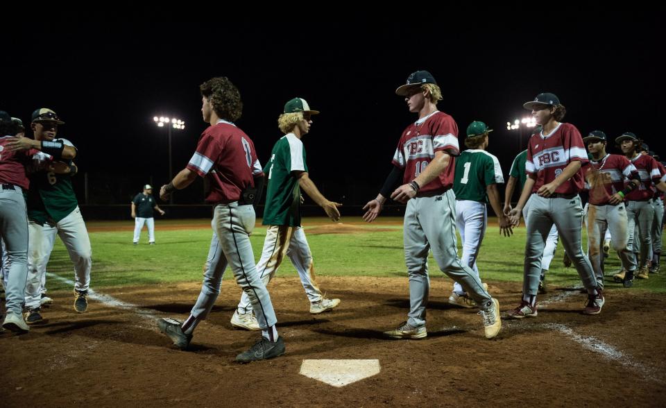 The Jupiter Warriors and Palm Beach Central Broncos shakes hands after the end of the District 11-7A championship baseball game between host Jupiter and Palm Beach Central on Thursday, May 4, 2023, in Jupiter, Fla. Final score, Jupiter, 11, Palm Beach Central, 3.