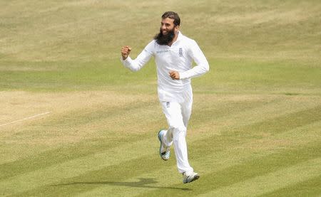 England's Moeen Ali celebrates after dismissing Mohammed Shami during the third cricket test match against India at the Rose Bowl cricket ground, Southampton, England July 31, 2014. REUTERS/Philip Brown