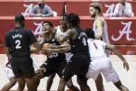 Mississippi State forward Tolu Smith (35) grabs a rebound as Alabama forward/guard Herbert Jones (1) reaches in during the first half of an NCAA college basketball game, Saturday, Jan. 23, 2021, in Tuscaloosa, Ala. (AP Photo/Vasha Hunt)