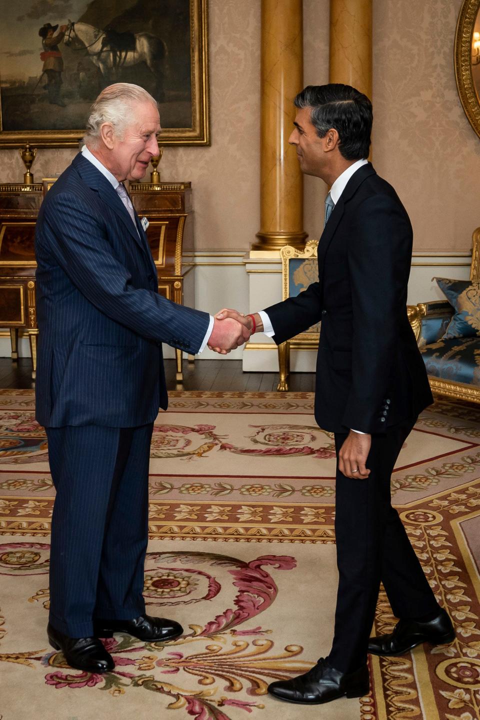 King Charles III welcomes Rishi Sunak during an audience at Buckingham Palace, London, where he invited the newly elected leader of the Conservative Party to become Prime Minister and form a new government, Tuesday, Oct. 25, 2022.