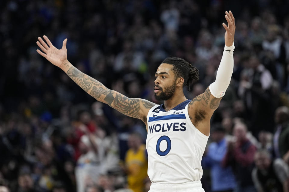 Minnesota Timberwolves guard D'Angelo Russell (0) celebrates after making a shot during the second half of an NBA basketball game against the Golden State Warriors, Wednesday, Feb. 1, 2023, in Minneapolis. (AP Photo/Abbie Parr)