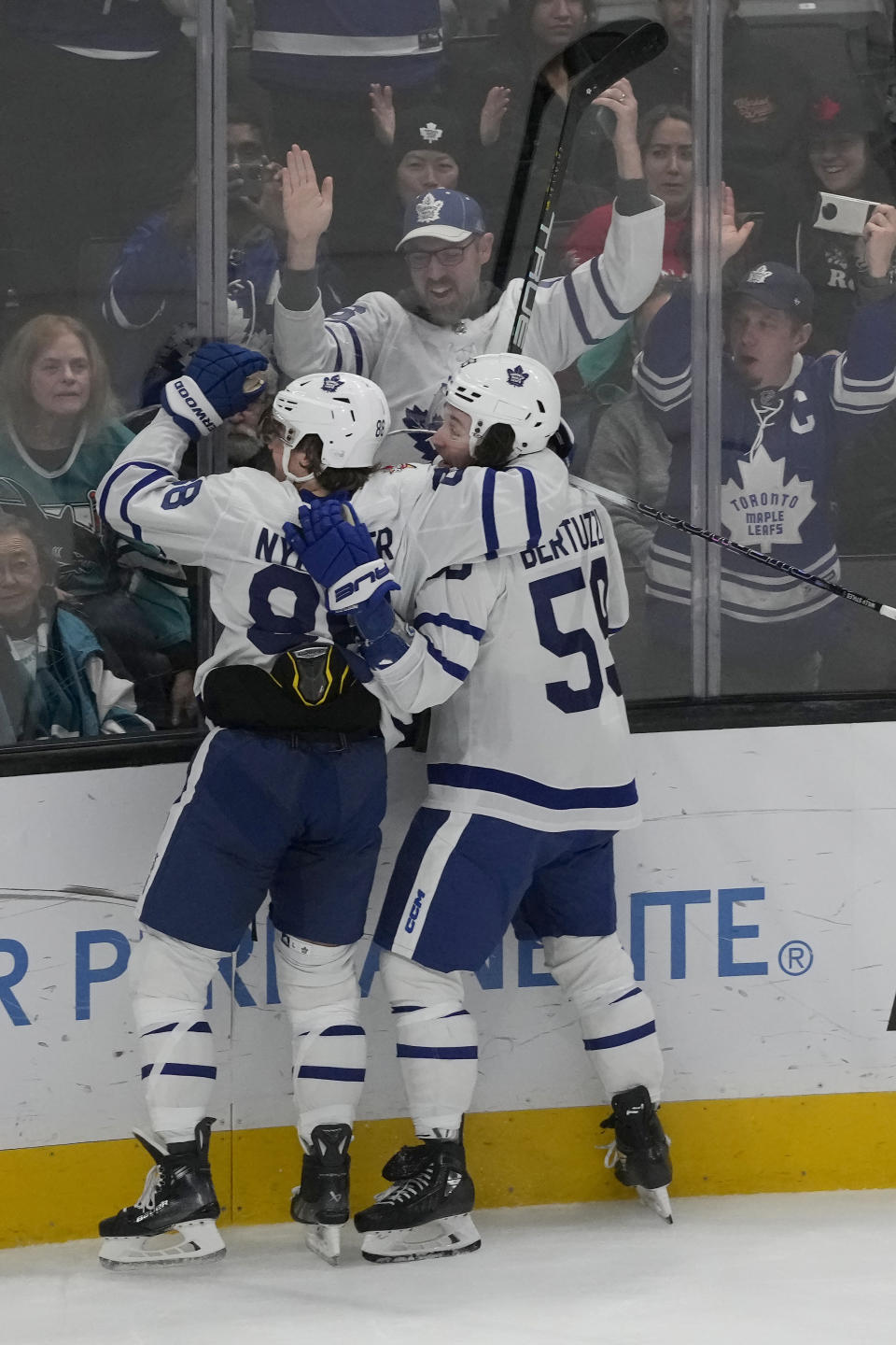 Toronto Maple Leafs right wing William Nylander, left, is congratulated by left wing Tyler Bertuzzi after scoring a goal against the San Jose Sharks during the third period of an NHL hockey game in San Jose, Calif., Saturday, Jan. 6, 2024. (AP Photo/Jeff Chiu)