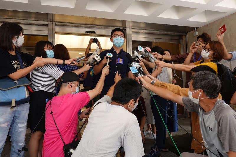 Pro-democracy activist Joshua Wong speaks to the media at the High Court in Hong Kong