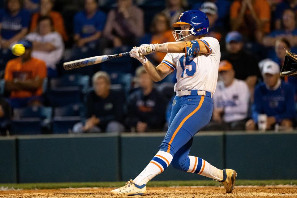 Florida Gators infielder Reagan Walsh (15) hits the ball against the LSU Tigers during the game at Katie Seashole Pressly Stadium at the University of Florida in Gainesville, FL on Monday, April 8, 2024. [Matt Pendleton/Gainesville Sun]