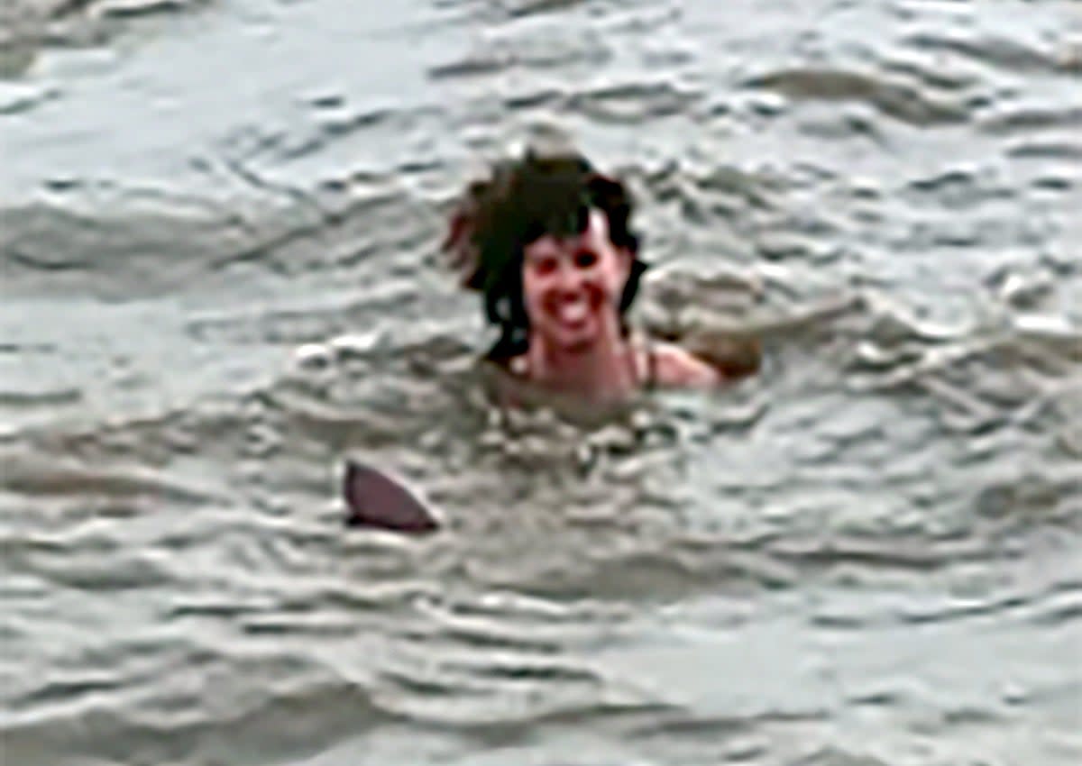 Claire Bye swimming with a dolphin in a river in Santa Rosa de Yacuma, Bolivia (Courtesy Claire Bye / SWNS)