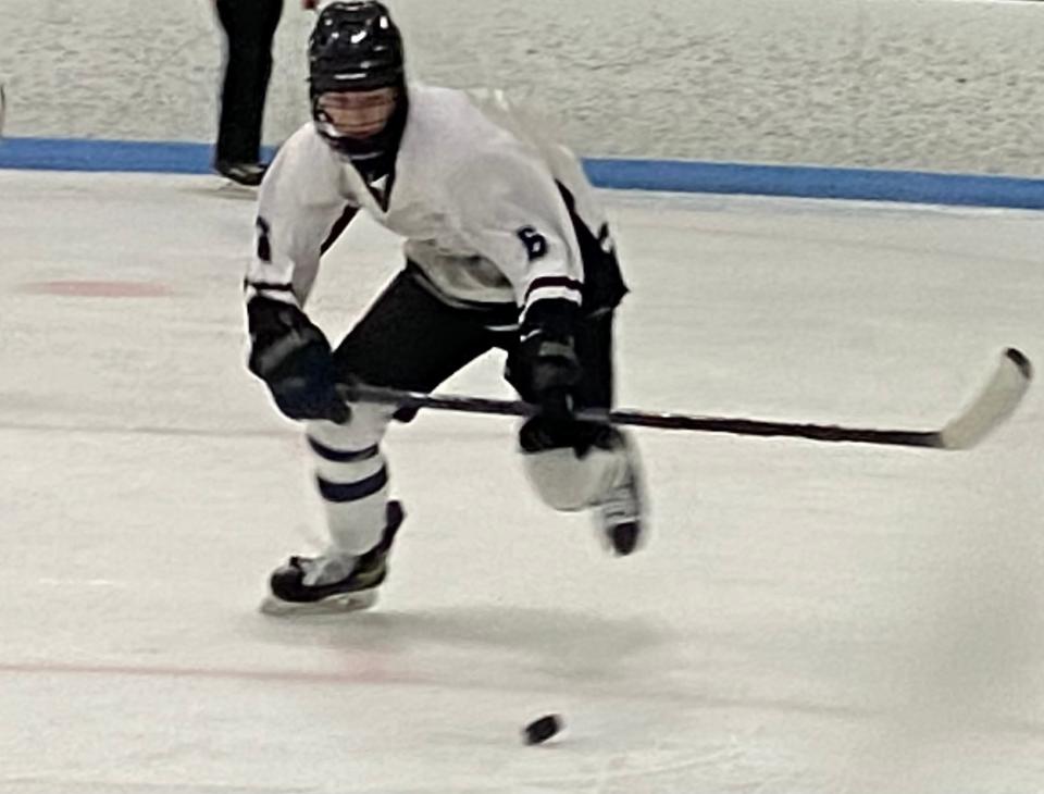 Zachary Miller closes in on the puck during Plymouth South's 2-1 overtime loss to Plymouth North on Jan. 4, 2023.