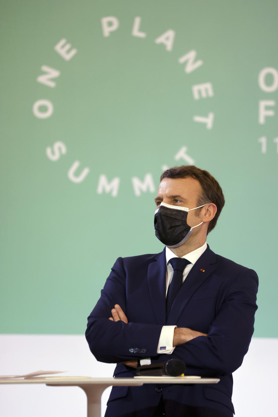 FILE - In this Jan. 11, 2021 file photo, French President Emmanuel Macron stands during the One Planet Summit, at The Elysee Palace, in Paris, France. World leaders breathed an audible sigh of relief that the United States under President Joe Biden is rejoining the global effort to curb climate change, a cause that his predecessor had shunned. (Ludovic Marin, Pool Photo via AP, File)