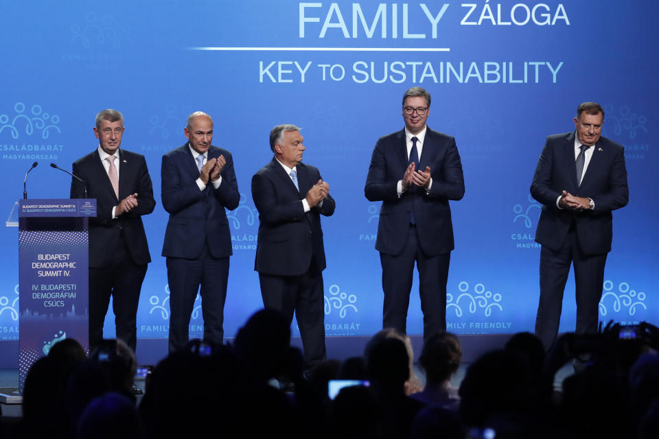 (Left to right) Czech Republic's Prime Minister Andrej Babis, Slovenian Prime Minister Janez Jansa, Hungary's Prime Minister Viktor Orban,Serbian President Aleksandar Vucic and Bosnian Serb member of the tripartite Presidency of Bosnia Milorad Dodik stand on stage during the 4th Budapest Demographic Summit in Budapest, Hungary, Thursday, Sept. 23, 2021. The biannual demographic summit, which was first organized in 2015, offers a forum for "pro-family thinker" decision-makers, scientists, researchers, and church representatives of the same sort to exchange their thoughts about connections between demographics and sustainability. (AP Photo/Laszlo Balogh)