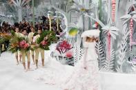 <p>An origami minefield was the stage for the Chanel Couture Spring show. A magical paper wonderland made even more wonderful by the interjectory male models who carried branches of flowers behind every couture clad maiden. </p>