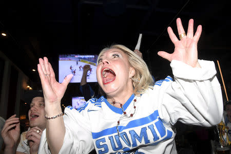 Finnish fans celebrate the goal at the 2019 IIHF Ice Hockey World Championship gold medal game between Canada and Finland, at a sports bar in Helsinki, Finland May 26, 2019. Picture taken May 26, 2019. Lehtikuva/Markku Ulander/via REUTERS